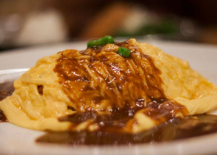 A Japanese omurice with a generous topping of demi-glace sauce.